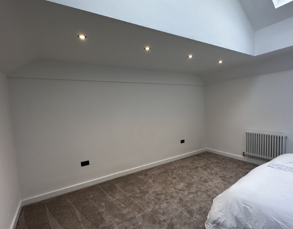 Recently decorated bedroom wall before fitted sliding wardrobes were installed