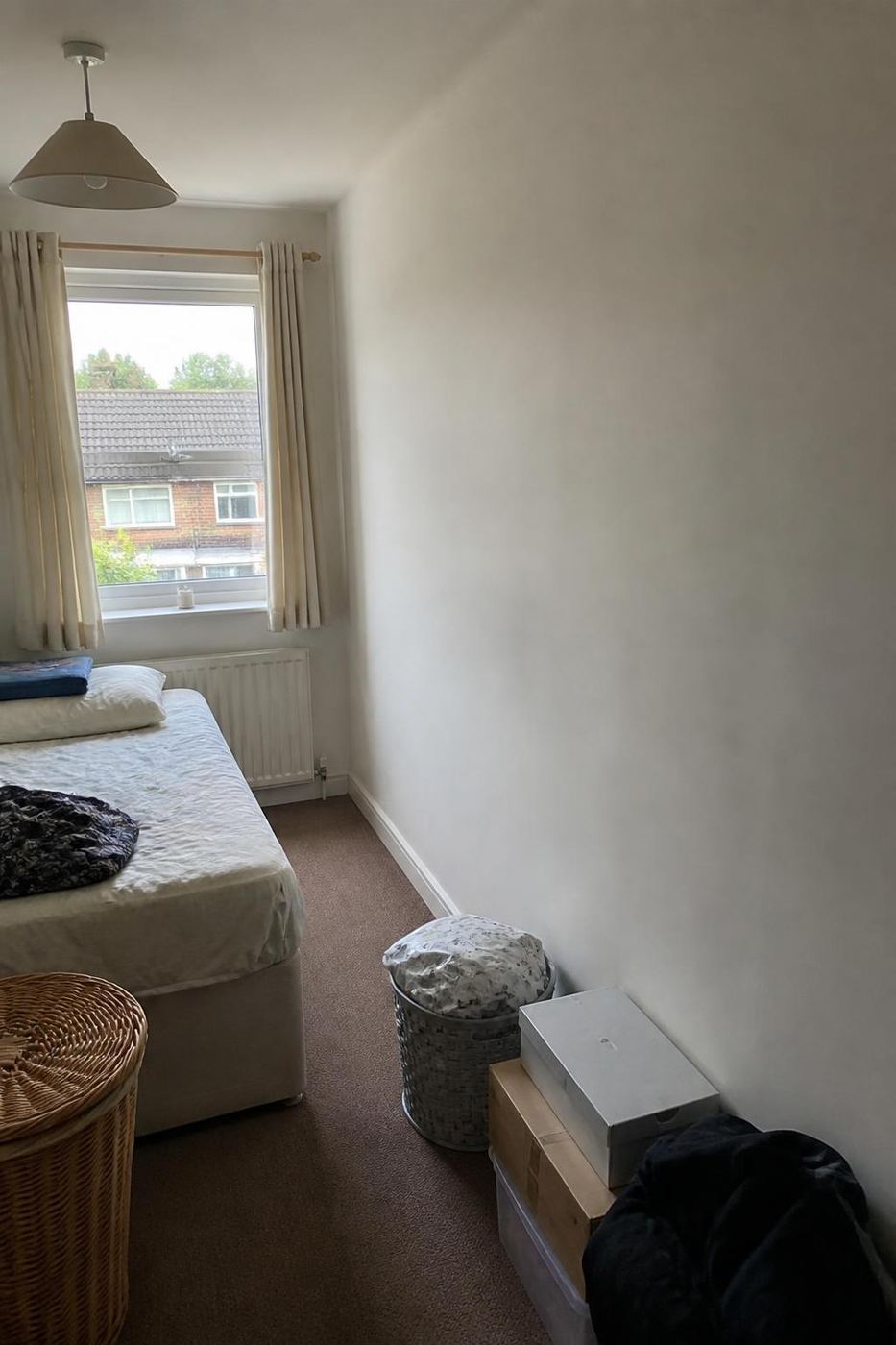 Bedroom in Caerphilly before dark panel and mirror sliding doors were fitted