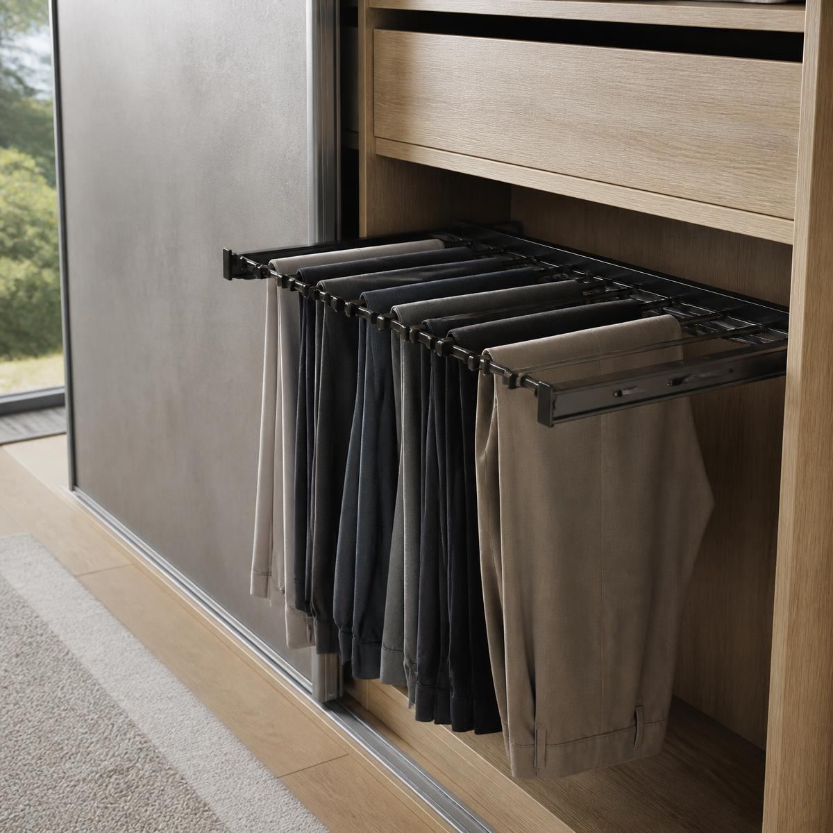 Pull-out trouser rail inside a fitted wardrobe holding neatly hung trousers